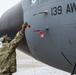 Airmen perform pre-flight inspections on C-130 Hercules aircraft