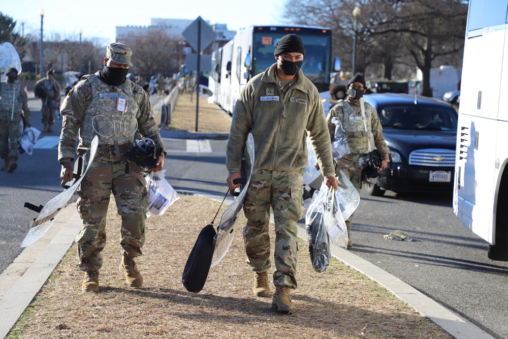 VING members receive riot gear prior to Inauguration