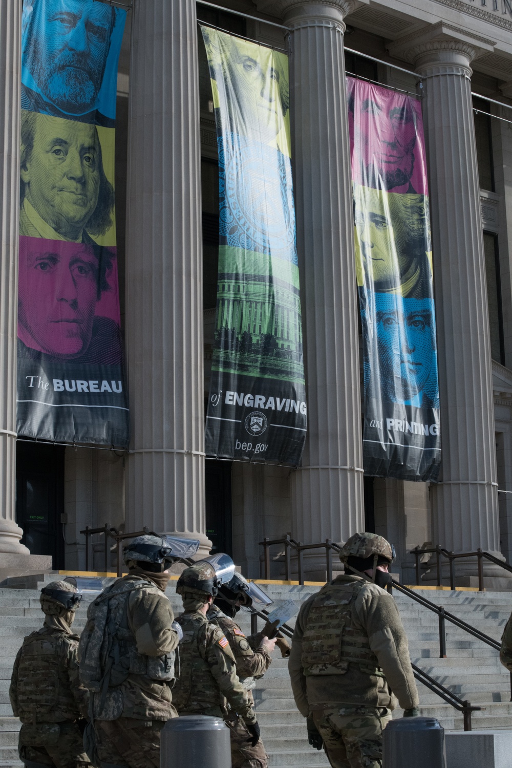 U.S. Soldiers from 851st Vertical Engineer Company walks beside Bureau of Engraving and Printing in Washington D.C.