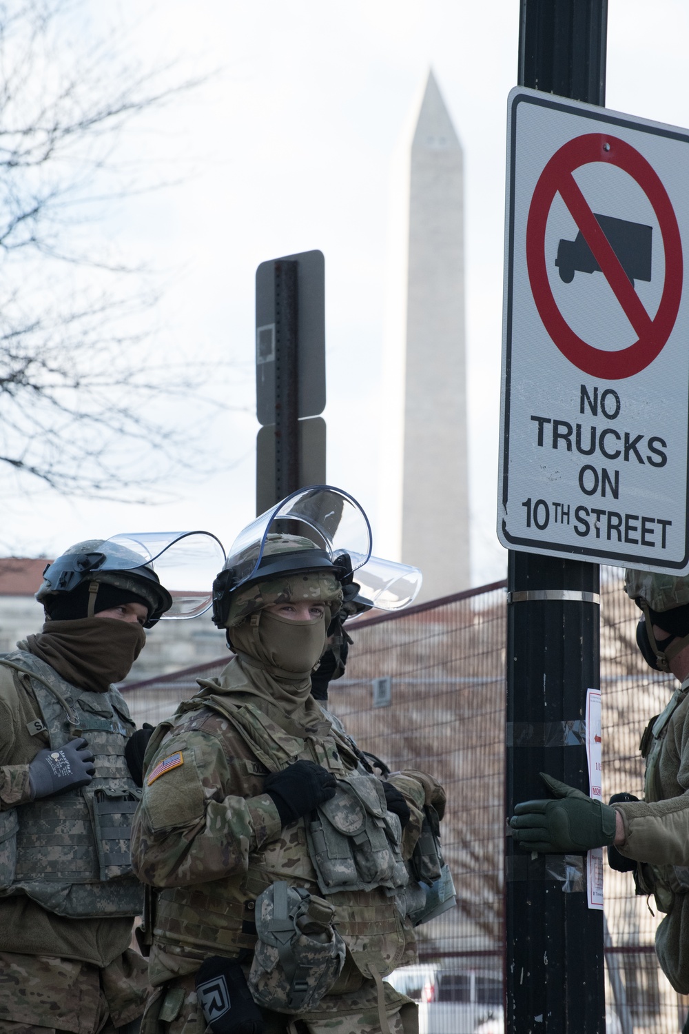 U.S. Soldiers from 851st Vertical Engineer Company stand in a staging area near the Washington Monument