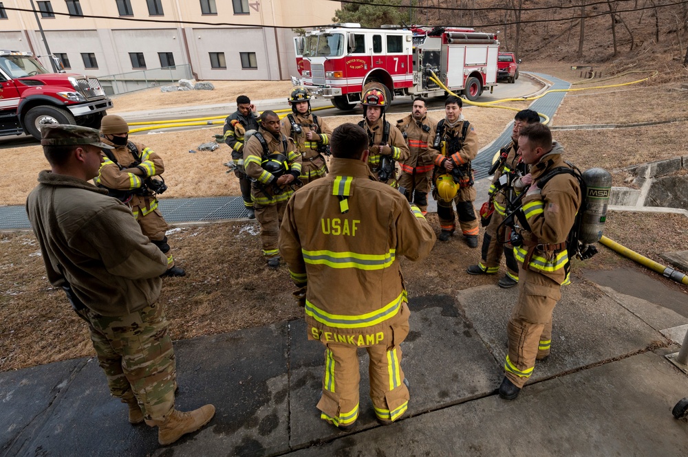 Osan FD practices fire training in real-world structure