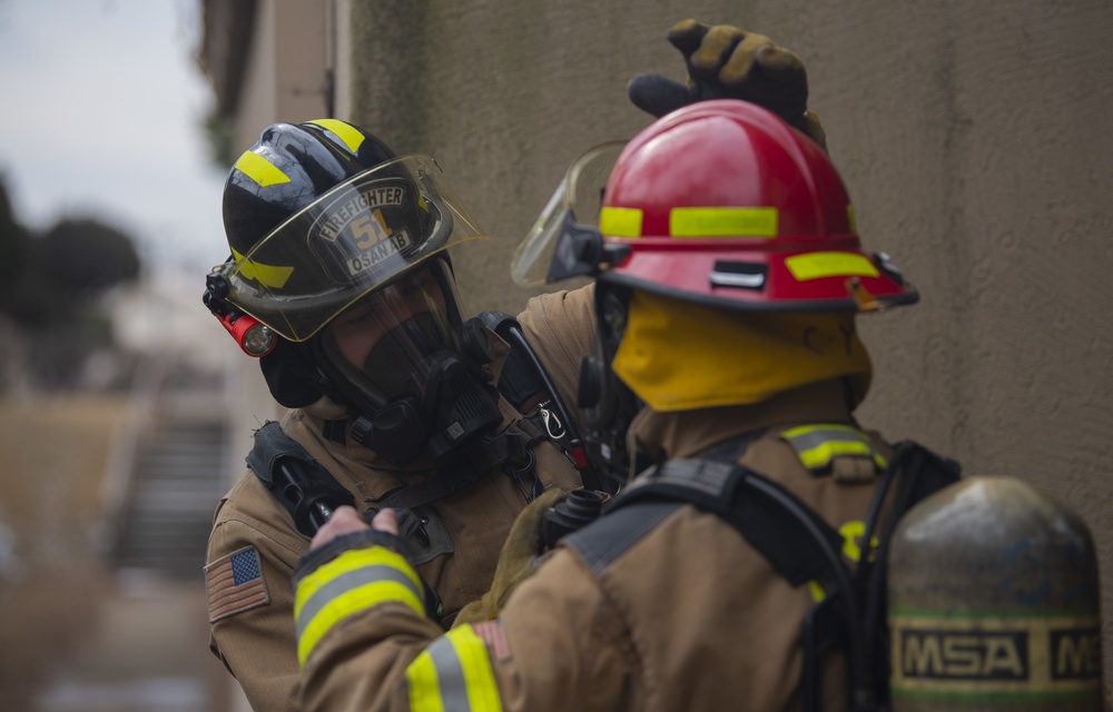 Osan FD Practices Fire Training in Real-World Structure