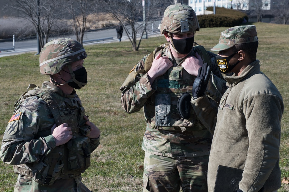 Battalion Command of the 682nd Engineeer Battalion, MN National Guard, speak with a soldier from the 850th Horizontal Engineer Company.