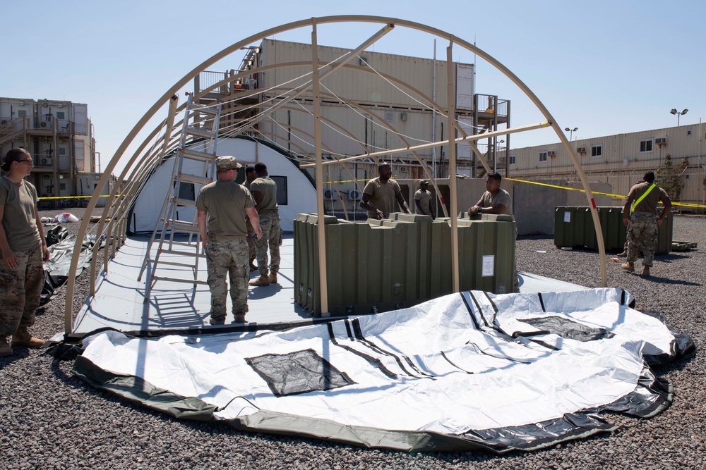 Soldiers Assemble Tents in Response to Troop Surge
