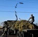 Transportation Soldiers haul away green debris