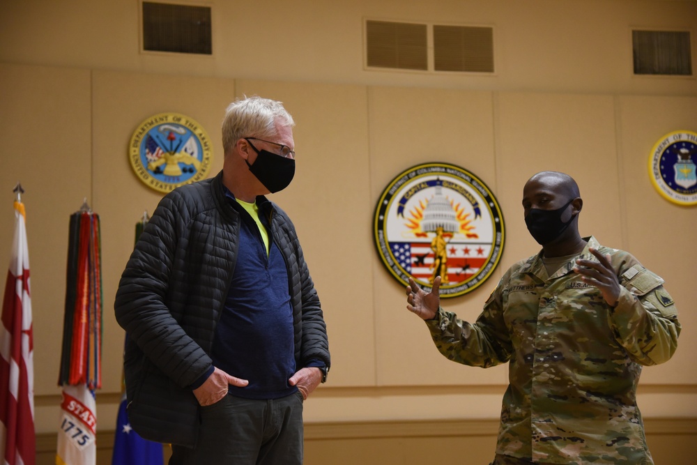 U.S. Army Col. Earl G. Matthews, right, staff judge advocate with Joint Force Headquarters, District of Columbia National Guard, speaks with Christopher C. Miller, the acting secretary of defense, at the D.C. Armory in Washington, D.C., Jan. 16, 2021