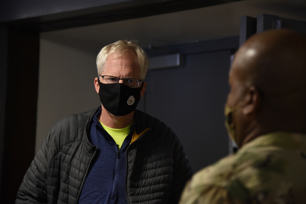 Christopher C. Miller, the acting secretary of defense, speaks with U.S. Army Lt. Col. Malik Freeman, the director of logistics with Joint Force Headquarters, District of Columbia National Guard, in Washington, D.C., Jan. 16, 2021