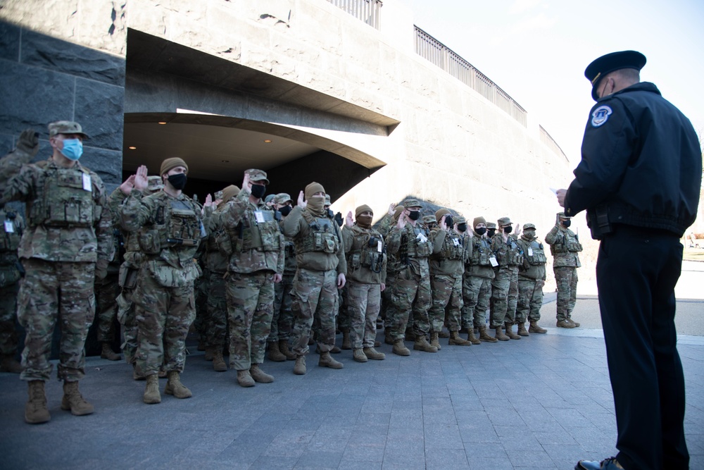 Soldiers with the Illinois National Guard are deputized by Capt. Andrew Bolinger of the U.S. Capitol Police in Washington, D.C., Jan. 19, 2021