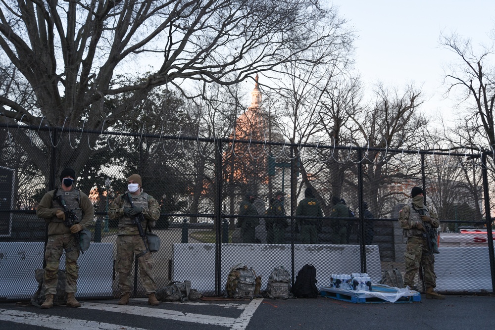 U.S. Soldiers and Airmen with the National Guard, provide security around the U.S. Capitol prior to the inauguration ceremony in Washington, D.C., Jan. 20, 2021