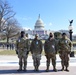 U.S. Soldiers with Alpha Company, 4th Battalion, 118th Infantry Regiment, South Carolina National Guard, pose for a photo in front of the Capitol in Washington, D.C., Jan. 20, 2021