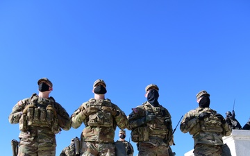 U.S. Soldiers with 3rd Battalion, 121st Infantry Regiment, Georgia National Guard, watch the inauguration in front of the Capitol in Washington, D.C., Jan. 20, 2021