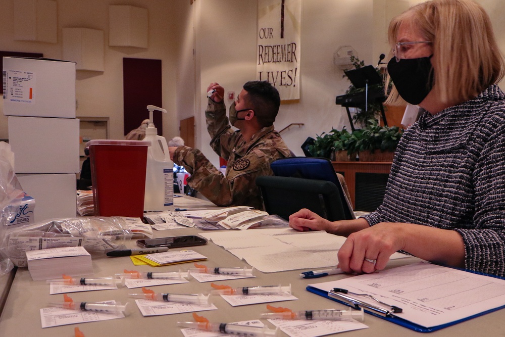 Volunteers and Michigan National Guard provide COVID vaccines in Lake Ann