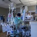 U.S. service members, local medical professional work together