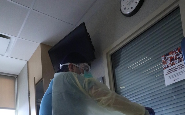 U.S. service members, local medical professional work together