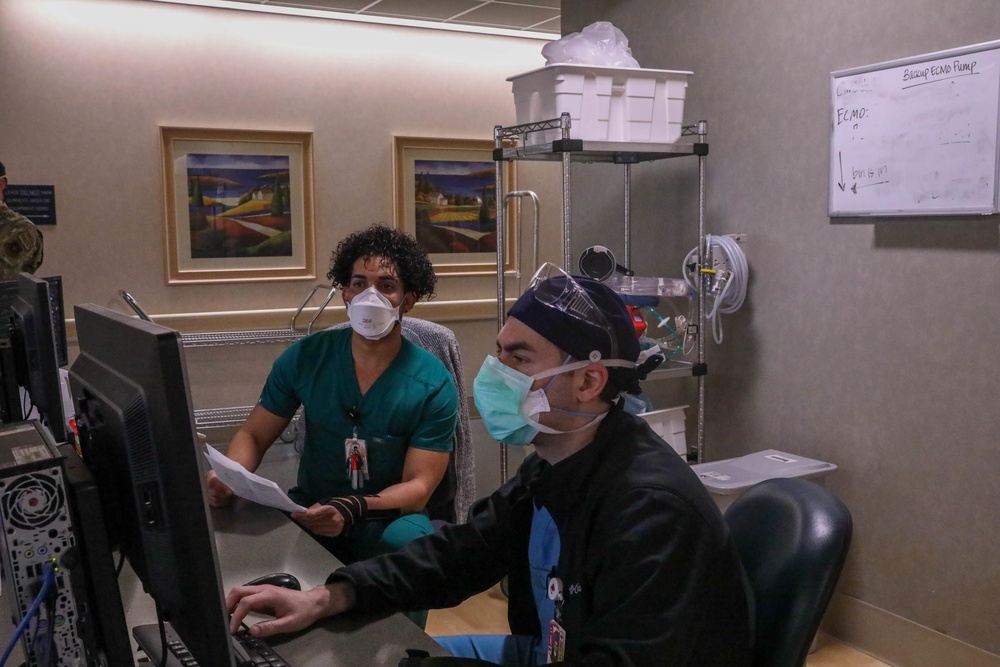 U.S. service members, local medical professional work together