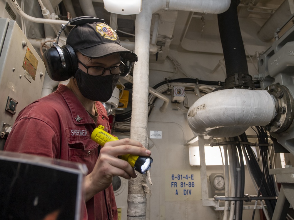 USS America (LHA 6) Sailor inspects fuel pump.