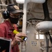 USS America (LHA 6) Sailor inspects fuel pump.