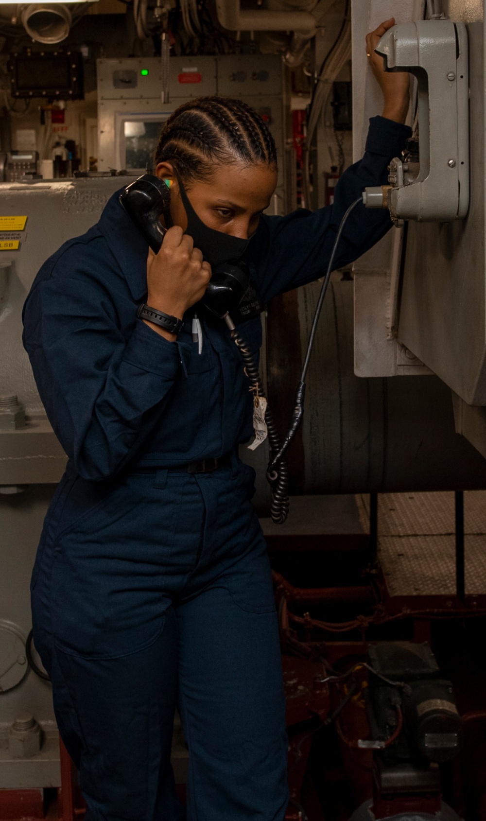 USS America (LHA 6) Sailor reports a simulated casuaty during drill.