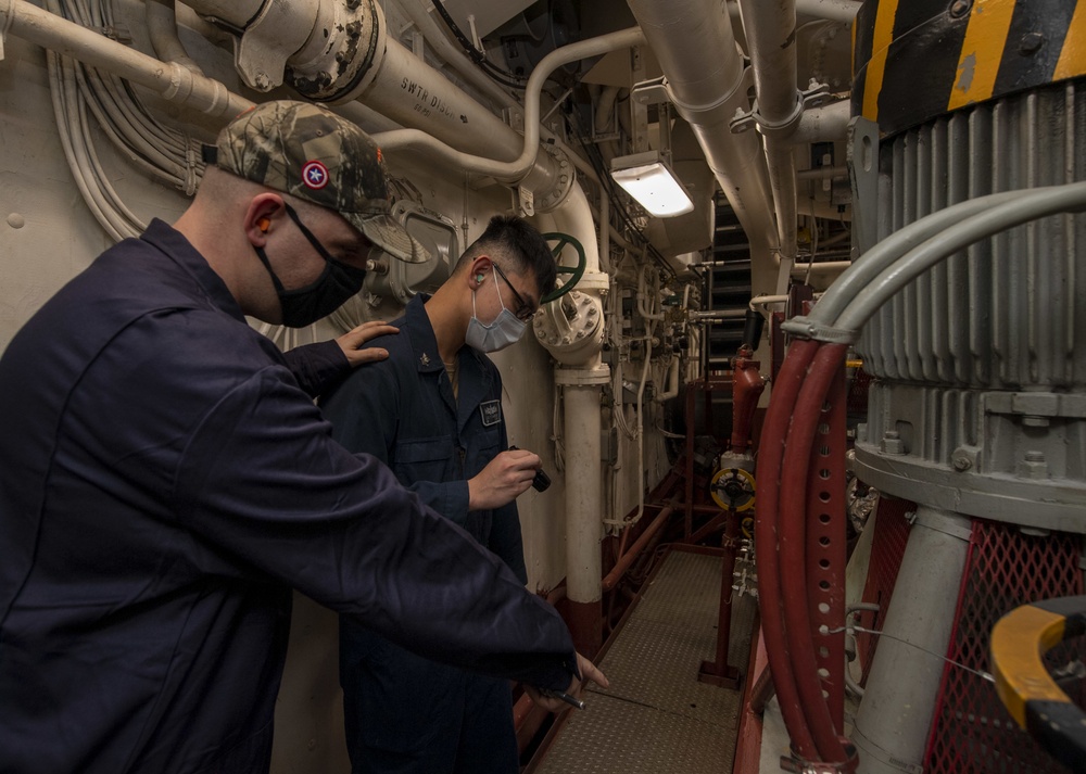 USS America (LHA 6) Sailors inspect lube oil fuel pump.