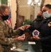 Cal Guard Col. Wooldridge trades challenge coins with CHP Commissioner Amanda Ray