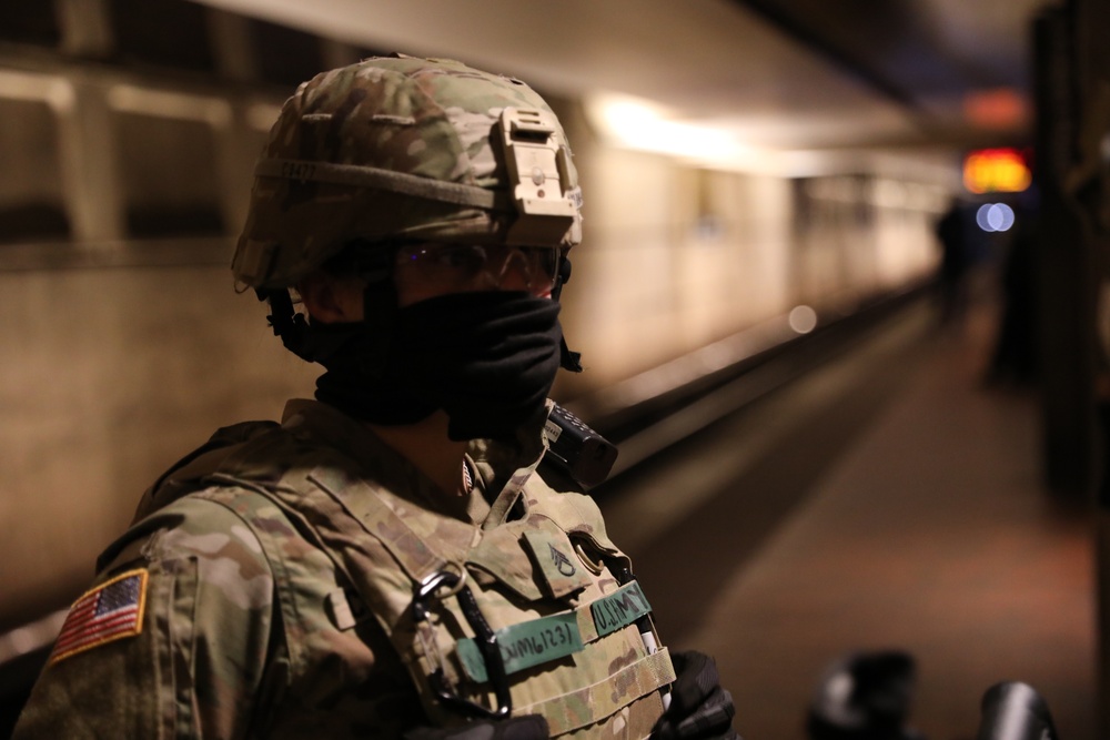 A North Carolina National Guard Soldier provides security in the L'Enfant Plaza Metro Station.