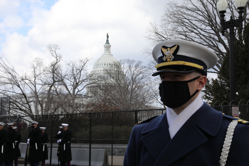 Members of the United States Joint Forces Color Guard stand in formation before the start of the 59th Presidential Inauguration parade.