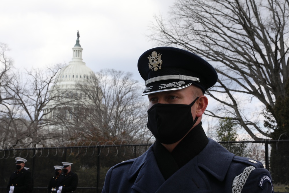 Members of the United States Joint Forces Color Guard stand in formation before the start of the 59th Presidential Inauguration parade.