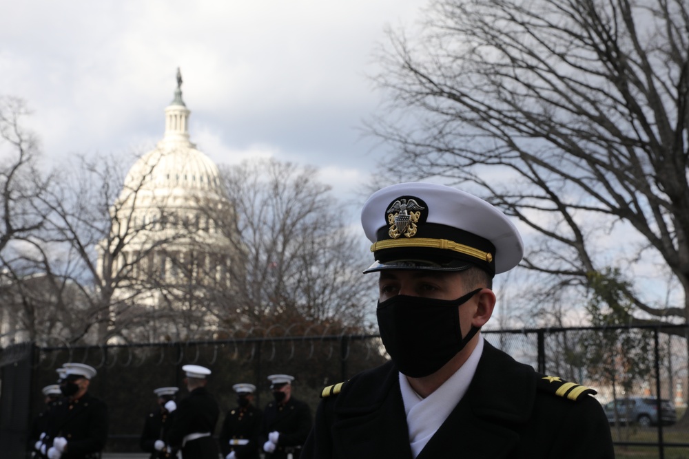 Members of the United States Joint Forces Color Guard stand in formation before the start of the 59th Presidential Inauguration parade.