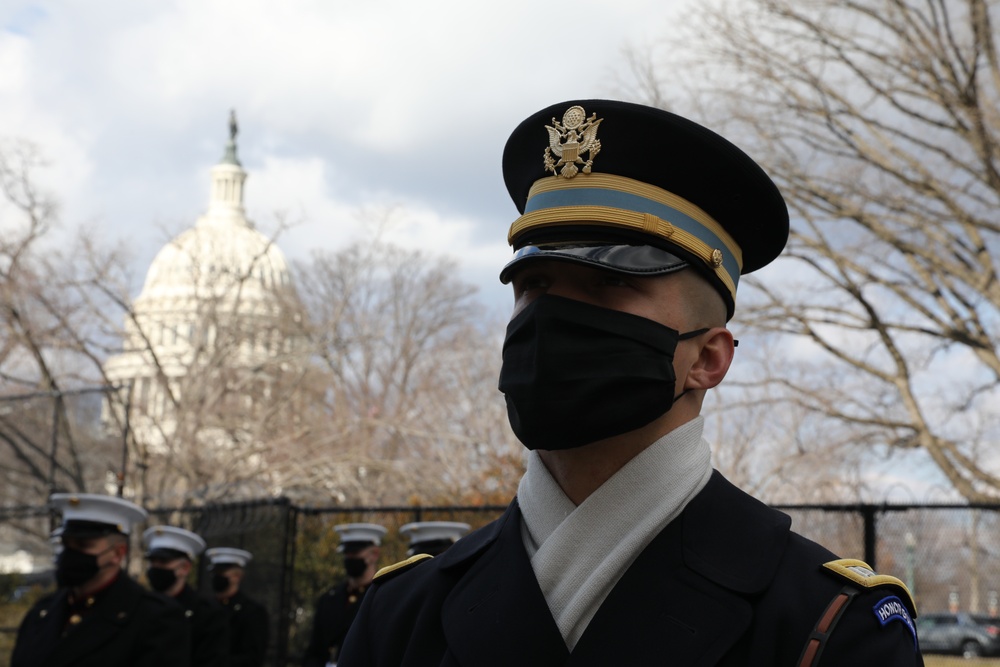 Members of the United States Joint Forces Color Guard stand in formation before the start of the 59th Presidential Inauguration parade.