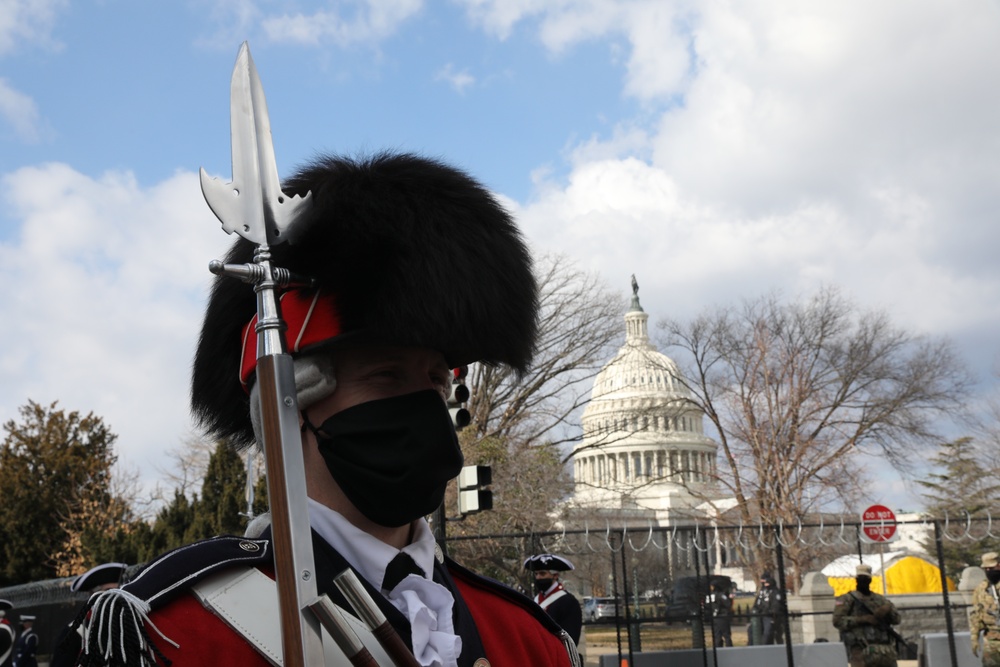 Members of the United States Joint Forces Color Guard stand in formation before the start of the 59th Presidential Inauguration parade.