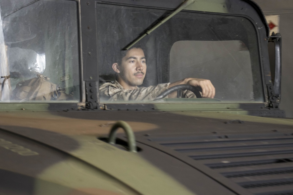 CLB-31 onloads vehicles onto the USS Ashland