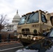 National Guard Soldiers drive past the U.S. Capitol building in Washington, D.C., prior to the 59th Presidential Inauguration, Jan. 20, 2021