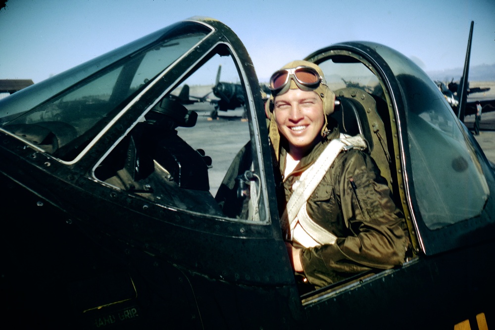 Ensign Ted Smyer in the cockpit of a Vought F4U Corsair