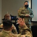 Army and Navy personnel receive command briefings during in-processing for COVID-19 response