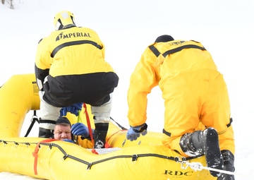 Fort Drum firefighters train on Remington Pond for cold-weather rescues