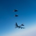 B-52 Stratofortresses fly in formation with U.S. Air Force F-15E Strike Eagles, Saudi Royal Air Force fighter jets, and U.S. Navy F/A-18 Hornets