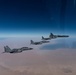 B-52 Stratofortresses fly in formation with U.S. Air Force F-15E Strike Eagles, Saudi Royal Air Force fighter jets, and U.S. Navy F/A-18 Hornets