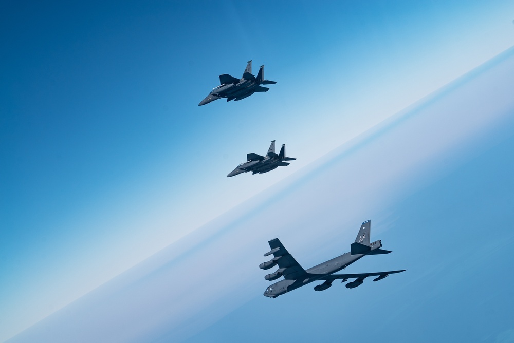 B-52 Stratofortresses fly in formation with U.S. Air Force F-15E Strike Eagles, Saudi Royal Air Force fighter jets, and U.S. Navy F/A-18 Hornets