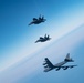 B-52 Stratofortresses fly in formation with U.S. Air Force F-15E Strike Eagles, Saudi Royal Air Force fighter jets, and U.S. Navy F/A-18 Hornets