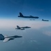 B-52 Stratofortresses fly in formation with U.S. Air Force F-15E Strike Eagles, Saudi Royal Air Force fighter jets, and U.S. Navy F/A-18 Hornets