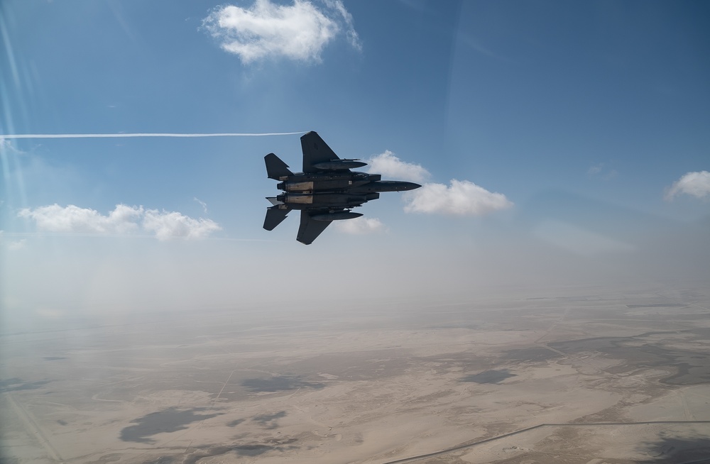 B-52 Stratofortresses fly in formation with U.S. Air Force F-15E Strike Eagles, Saudi Royal Air Force fighter jets, and U.S. Navy F/A 18 Hornets