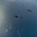 B-52 Stratofortresses fly in formation with U.S. Air Force F-15E Strike Eagles, Saudi Royal Air Force fighter jets, and U.S. Navy F/A-18 Hornets