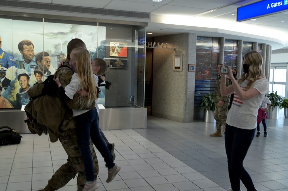 U.S. Airmen from 126th Civil Engineer Squadron and 126th Force Support Squadron return home from a six month deployment to Africa.