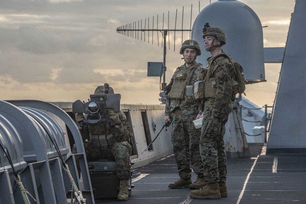 Snipers provide over-watch during VBSS mission