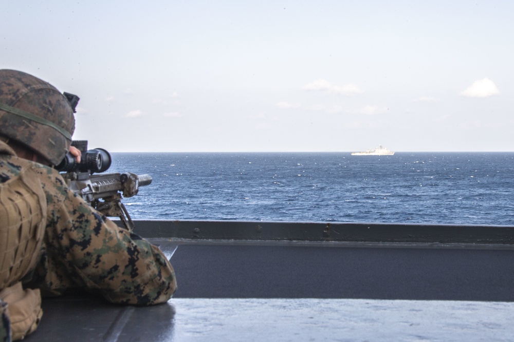 Snipers provide over-watch during VBSS mission