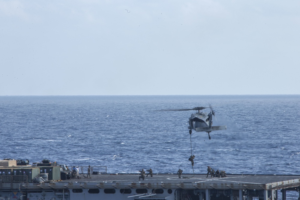 Snipers provide over-watch during VBSS mission