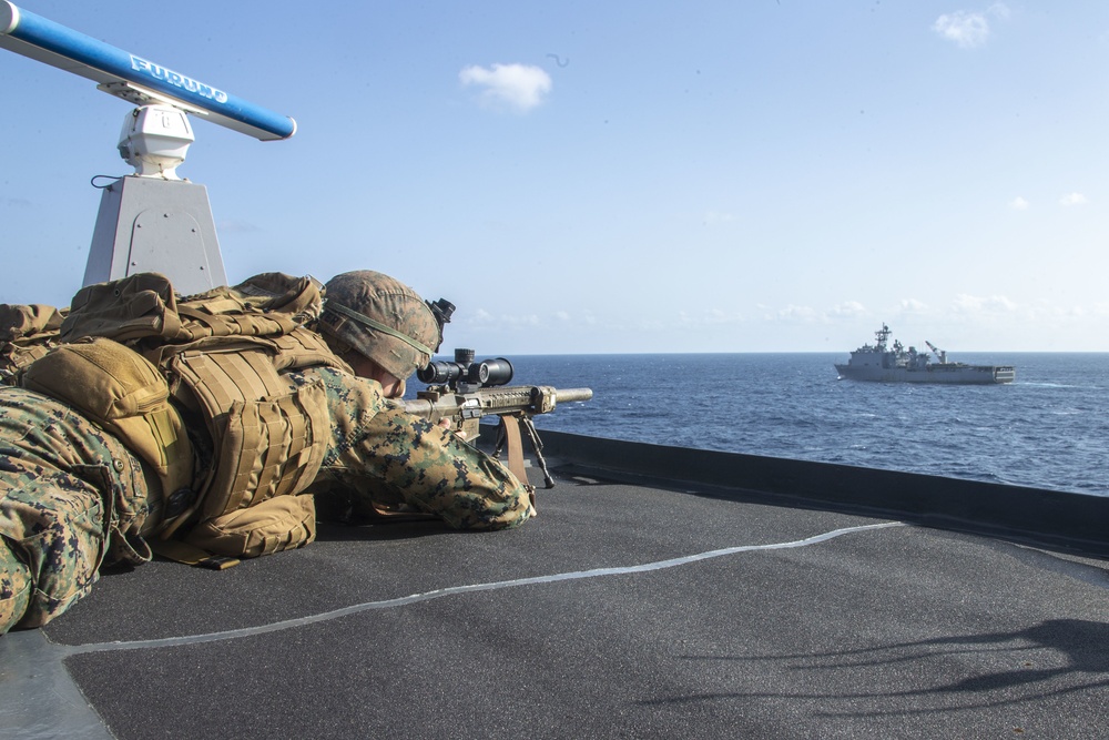 Snipers provide over-watch during VBSS mission