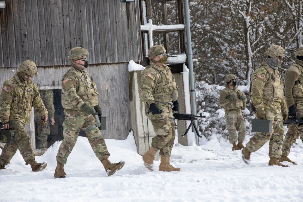 Soldiers assigned to 1-6 Field Artillery Regiment go the snow covered range to qualify on their M240 Bravo.
