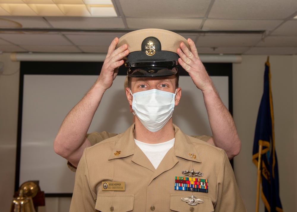 RPC Jesse Kiepper, receives his anchors during USS Constitution’s Chief Petty Officer pinning ceremony