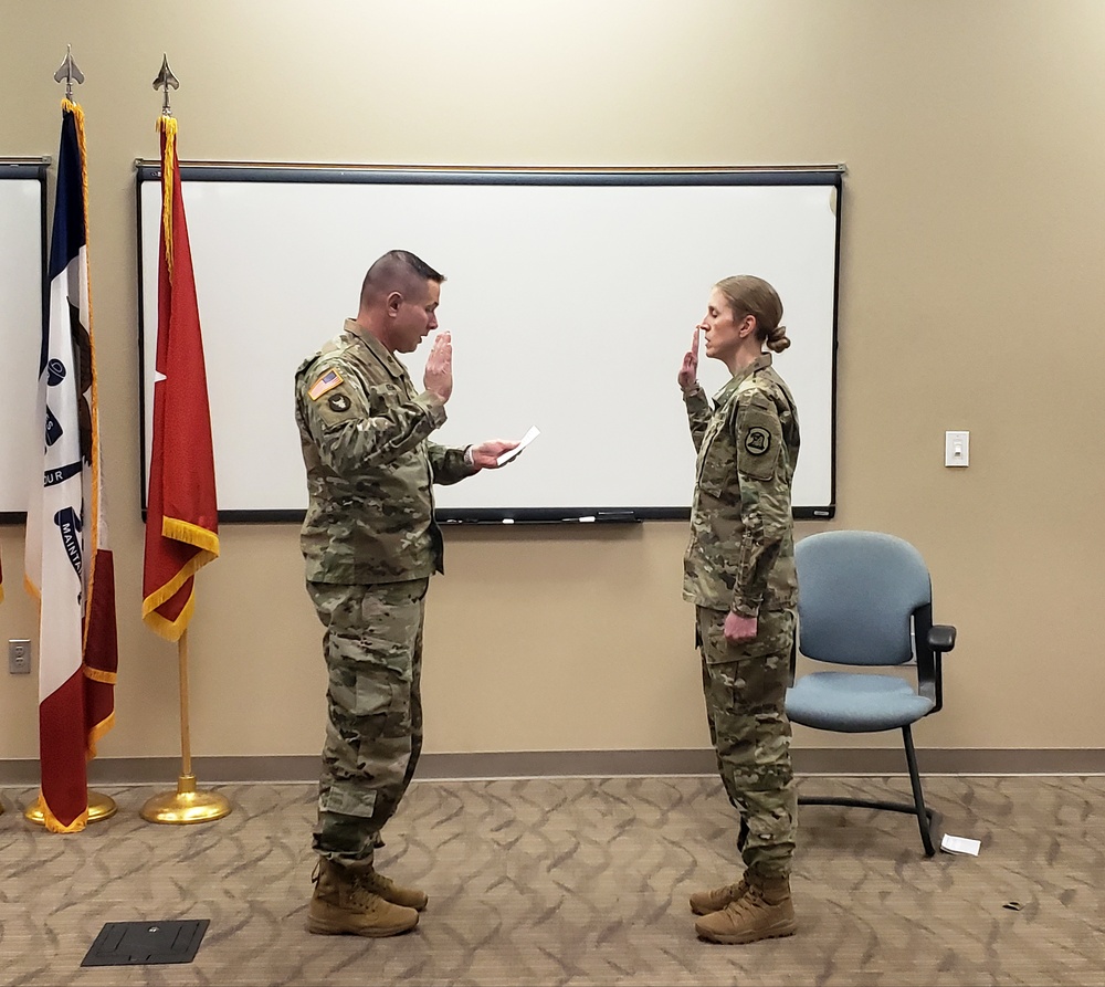 Brig. Gen. Kremer conducts the Oath of Office with Col. Wendy Johnson, Iowa National Guard